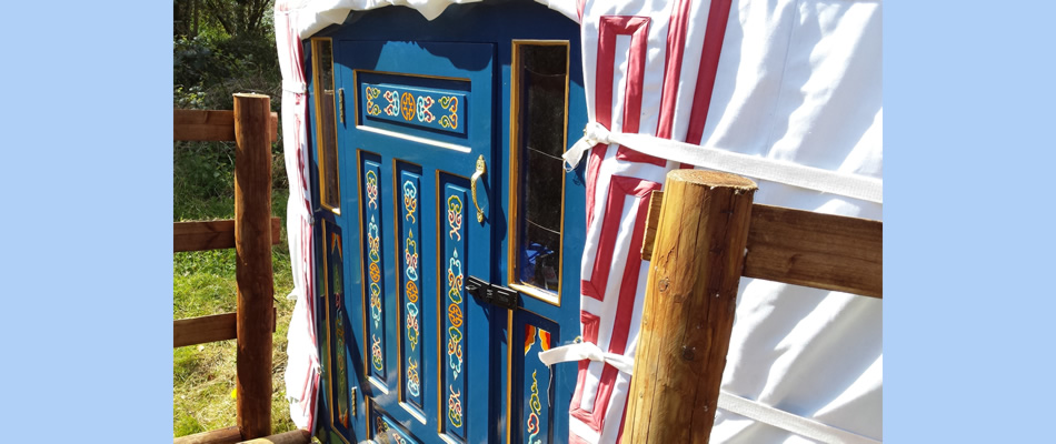 The haindpainted front door of the yurt Snuggledown